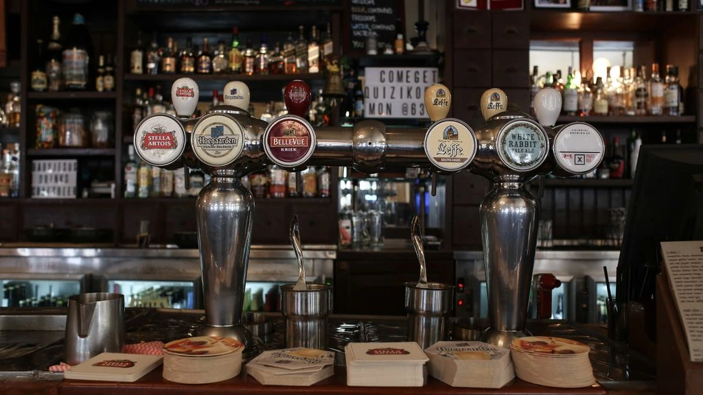 The Coppermine Pub's 24-line copper draught wall, photographed at golden hour