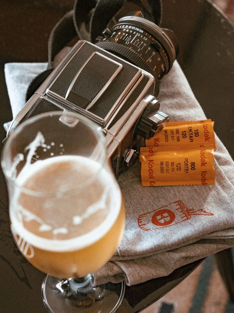 The Coppermine Pub's beer director selecting a new pour for the rotation at a wooden prep table