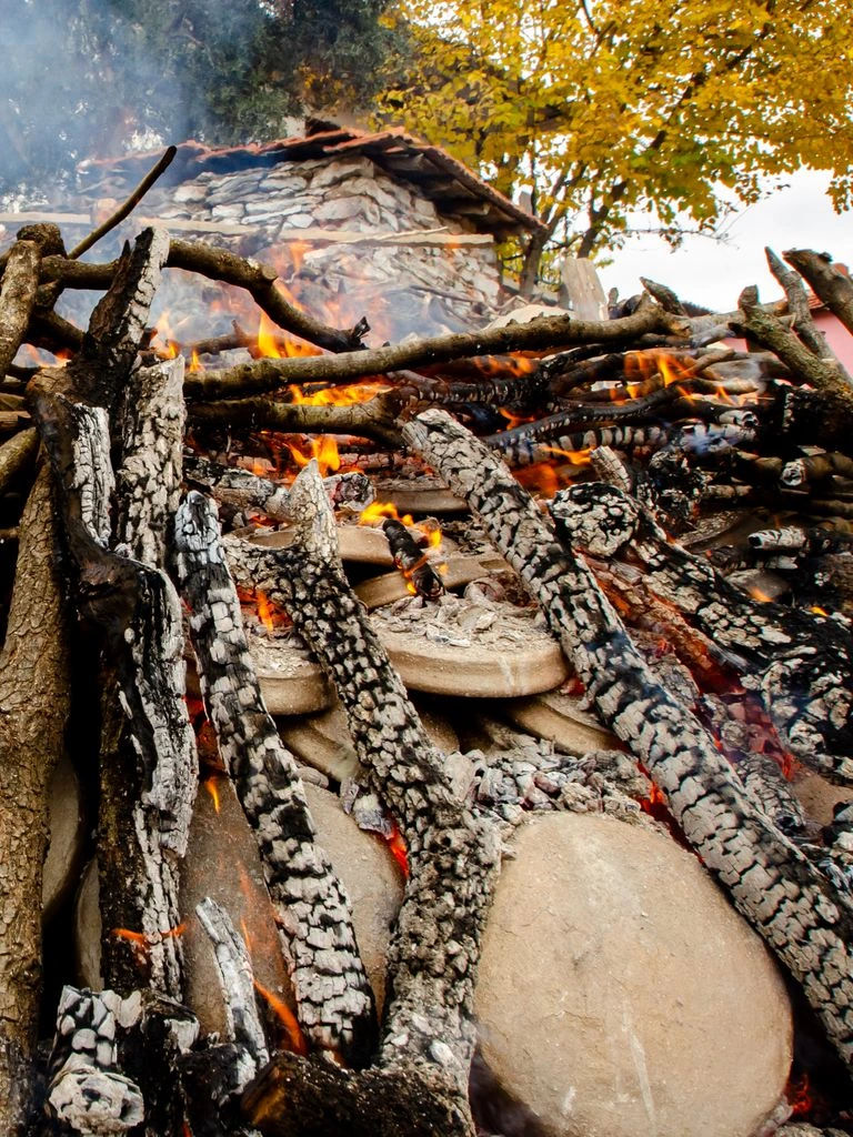 The 480°C wood-fired stone hearth turning out pizza in ninety seconds